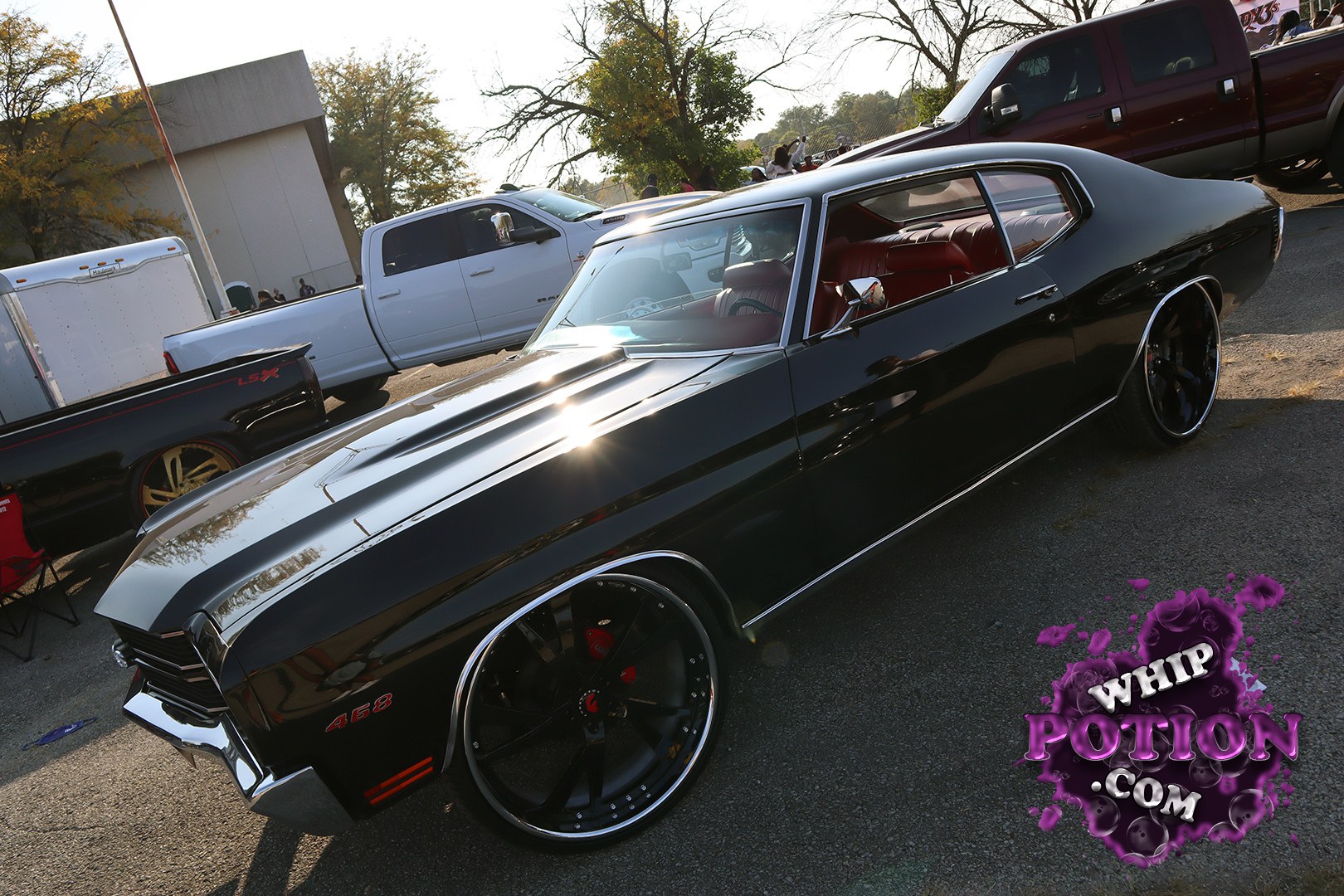 This black Chevrolet Chevelle 468 has the kind of old-school muscle presence that never gets old, with a deep gloss finish, red interior, and oversized black-and-chrome wheels filling the tubs just right. The clean stance and polished trim give it a smooth, pro-touring feel without losing that classic A-body attitude.