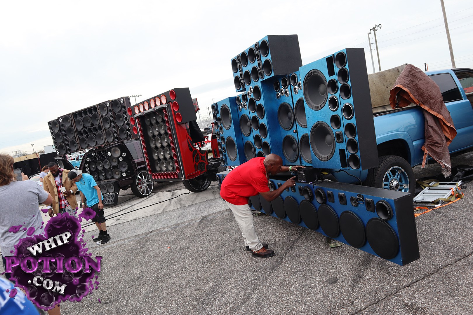 This custom blue pickup is all about pure decibels, with a bed full of towering speaker cabinets packed with subs, mids, and horns. The matching blue wheels and lifted stance give it some presence, but the real story is the wall of audio hardware wired in for serious sound pressure runs.