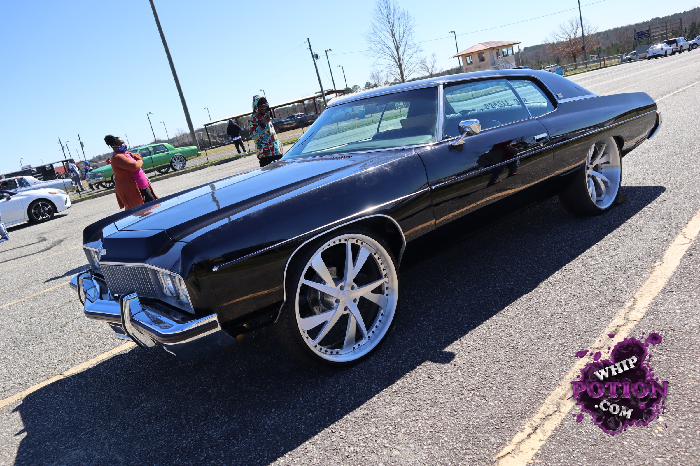 This classic Buick coupe has the kind of presence that comes from clean lines and serious hardware: deep black paint, massive polished five-spokes, and a long, low stance that fits the car’s big-body attitude. The chrome front end and tight body trim keep it classy, while the oversized wheels give it a bold modern custom touch.