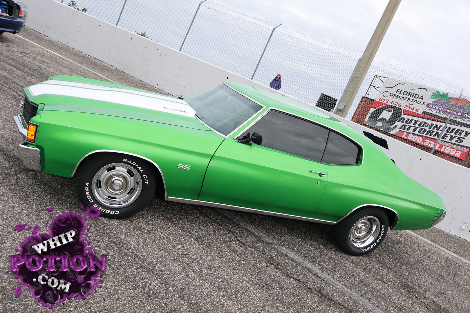 A bright green Chevrolet Chevelle SS sits with a clean muscle-car stance, finished off by bold white hood stripes, tinted glass, and polished steelies wrapped in Goodyear Cobra Radial GTs. The long hood, crisp body lines, and SS badge give it that classic late-’60s attitude, and at Linny J Official MLK Weekend Car Show 2021 it had the kind of presence Chevy fans live for.